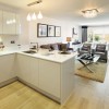 Oakford Homes, a view of the kitchen and living room magazine for builders